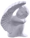 Cherub with Head on Knees Statue left