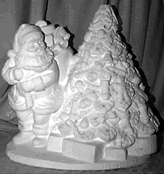 Light Up Santa Next to Tree statue