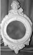 Cherub on round Mirror